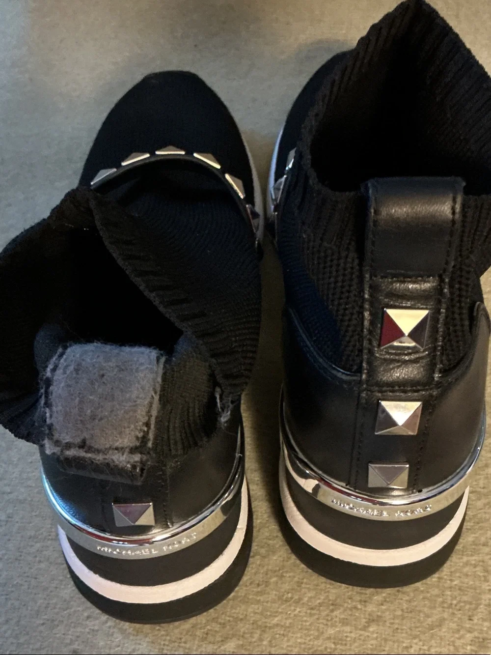 Michael Kors Black Knit Slip-On Sneakers with Silver Pyramid Stud Strap